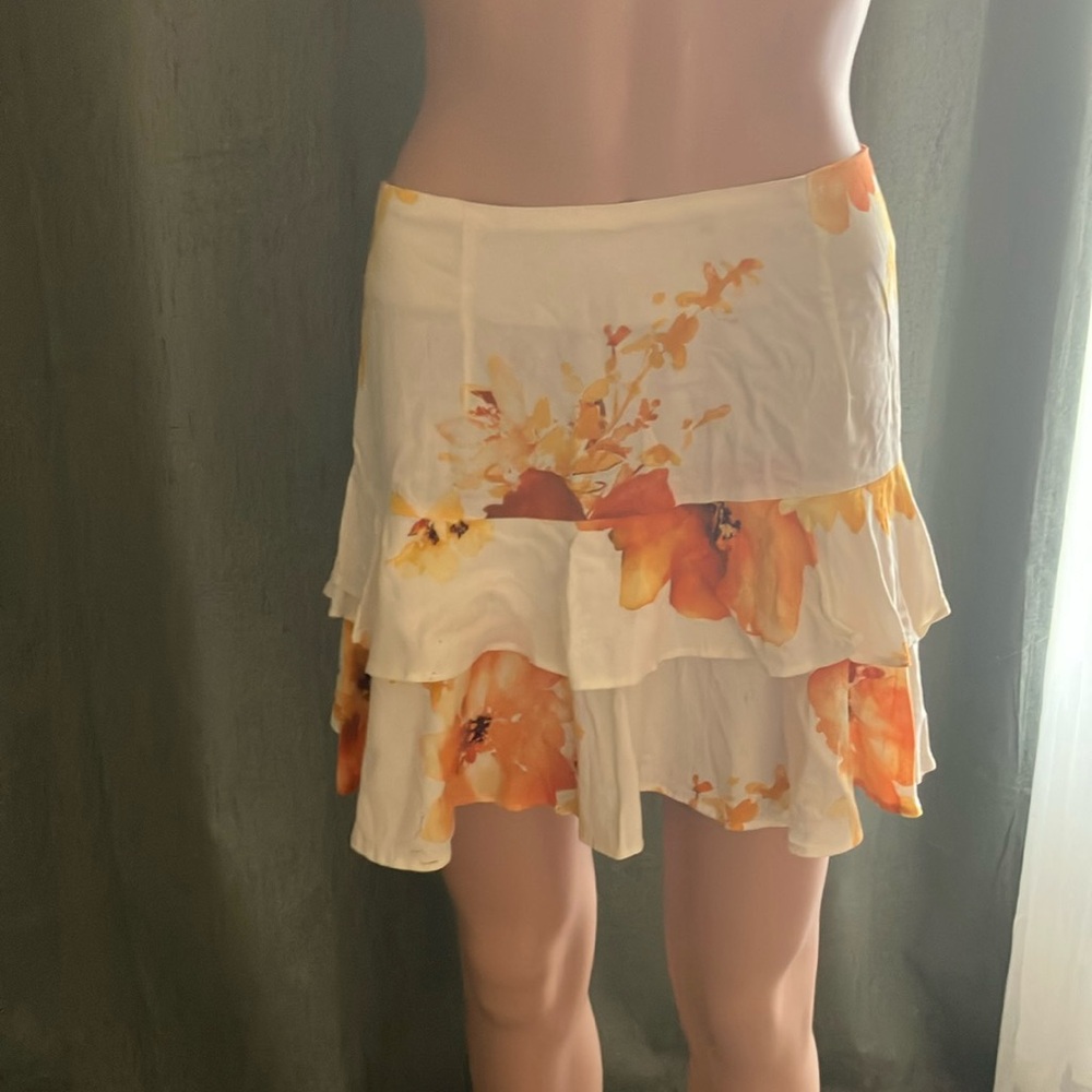 Off white mini dress with orange flowers 
Size Medium